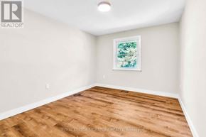 Newmarket (Gorham-College Manor) apartment for rent - A room with wooden flooring and a framed picture on the wall.