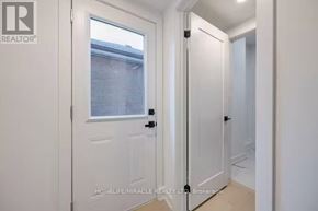 Toronto (Mimico) apartment for rent - A white door with a glass window is closed.