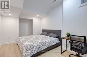 Toronto (Mimico) apartment for rent - A bedroom with a bed, desk, and chair.