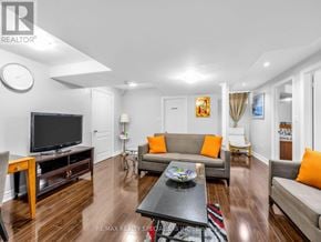 Brampton (Credit Valley) apartment for rent - A living room with a grey couch and a black coffee table.