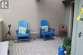 Blue Mountains townhouse for rent - Two blue chairs and a small table are on a patio.
