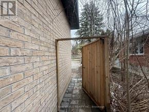 Markham (Bullock) apartment for rent - A wooden gate is open, leading to a pathway.