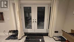 Markham (Bullock) apartment for rent - A pair of shoes are on a black mat in front of a white door.