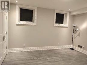 Markham (Bullock) apartment for rent - A room with two windows and a lamp on the floor.