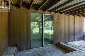 Toronto (Mount Pleasant West) apartment for rent - A wooden building with a glass door and window.