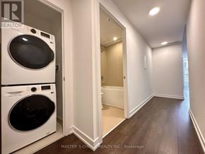 Toronto (South Riverdale) condo for rent - A laundry room with a washer and dryer in it.