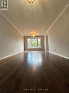Toronto (Wexford-Maryvale) apartment for rent - A room with wooden floors and a chandelier.