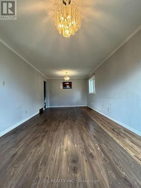 Toronto (Wexford-Maryvale) apartment for rent - A room with wooden flooring and a chandelier.