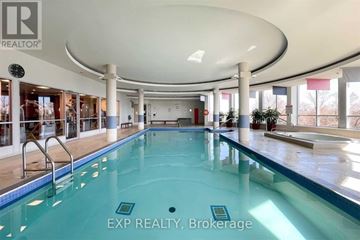 Toronto (Bayview Village) condo for rent - A large indoor swimming pool with a glass bottom.