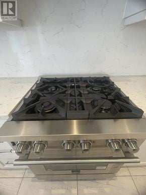 Aurora (Bayview Southeast) apartment for rent - A stainless steel gas stove with four burners and two ovens.
