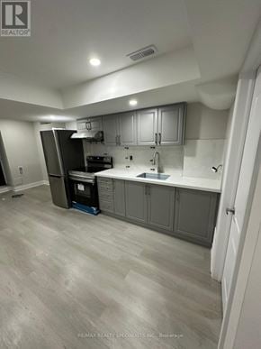 Brampton (Northwest Sandalwood Parkway) apartment for rent - A kitchen with a refrigerator, cabinets, and a countertop.