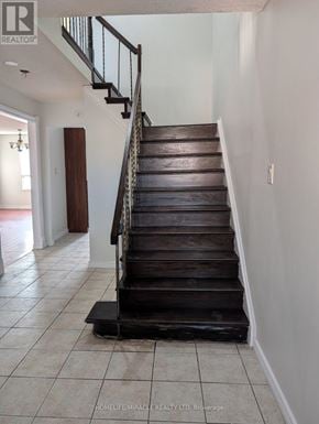 Brampton (Heart Lake West) apartment for rent - A staircase with a wooden tread and metal handrails.