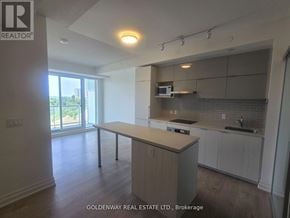 Markham (Unionville) condo for rent - A kitchen with a white counter top and cabinets.