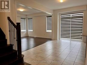 Southgate apartment for rent - A spacious room with a staircase and sliding doors.