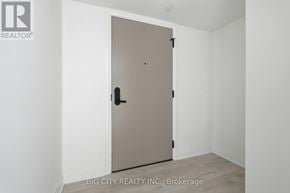 Toronto (Thorncliffe Park) condo for rent - A beige door in a white room with a logo on the top left.