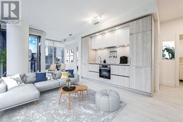 Toronto (Waterfront Communities) condo for rent - A modern living room with a grey sofa and a wooden coffee table.