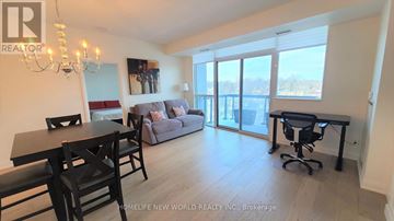 Mississauga (Port Credit) condo for rent - A well-lit living room with a dining table and chairs.