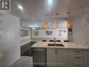 Richmond Hill (Crosby) apartment for rent - A kitchen with a marble countertop and a sink.