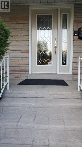 Toronto (Bayview Village) apartment for rent - A white door with a glass window and a black mat in front of it.