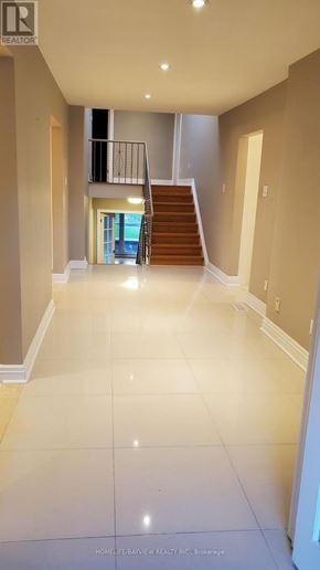 Toronto (Bayview Village) apartment for rent - A spacious hallway with a staircase leading to the second floor.
