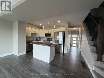 Petawawa townhouse for rent - A spacious kitchen with a stainless steel refrigerator and a modern design.