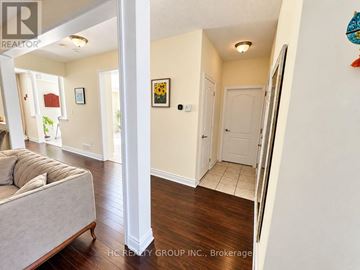 Bradford West Gwillimbury (Bradford) apartment for rent - A living room with a couch and a white door.