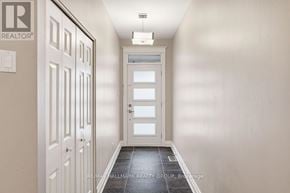 Ottawa townhouse for rent - A hallway with a white door and a white wall.