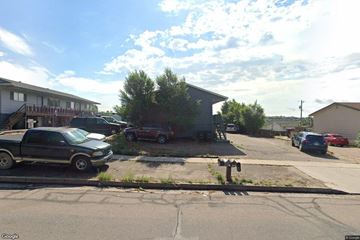 Colorado Springs apartment for rent - A street view with cars parked on the side of the road.