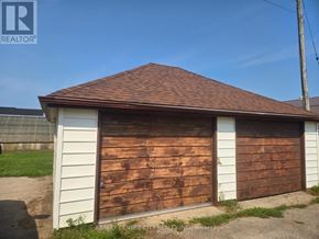 Malahide apartment for rent - A brown garage door with a white trim.