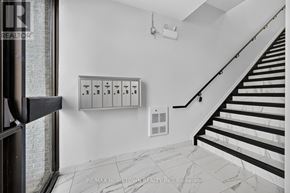 Brockville house for rent - A staircase with a black railing and white steps.