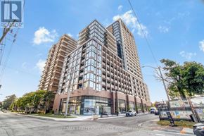 Mississauga (Port Credit) condo for rent - A tall building with many windows is the main focus of the image.