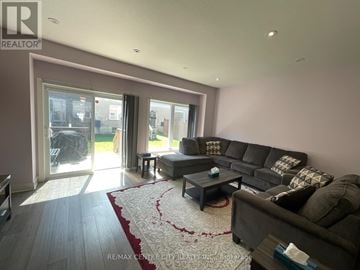 London South (South U) townhouse for rent - A living room with a grey couch and a coffee table.