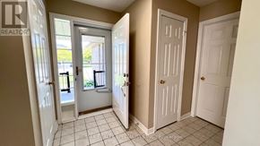Barrie (Painswick South) apartment for rent - A hallway with white doors and a tiled floor.