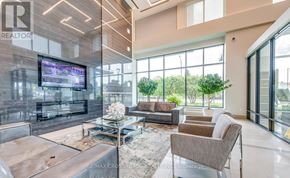 Mississauga (City Centre) condo for rent - A modern living room with a large television and comfortable seating.
