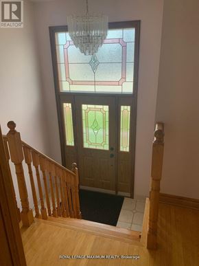 Vaughan (West Woodbridge) apartment for rent - A stained glass window in a home with a wooden staircase.