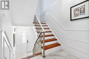 Markham (German Mills) townhouse for rent - A staircase with white walls and wooden steps.
