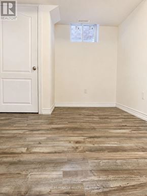 Brampton (Northwest Brampton) apartment for rent - A room with a white door and a window with blinds.