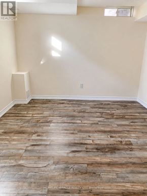 Brampton (Northwest Brampton) apartment for rent - A room with wooden flooring and a window.