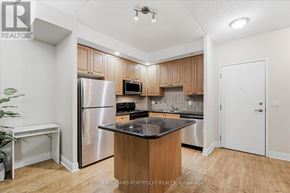 Markham (Unionville) condo for rent - A kitchen with a refrigerator, microwave, and oven.