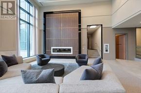 Mississauga (City Centre) condo for rent - A living room with a fireplace and a couch.