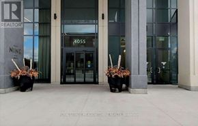 Mississauga (City Centre) condo for rent - The entrance to a building with a glass door and a sign that reads "4055".