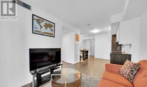 Toronto (Church-Yonge Corridor) condo for rent - A living room with a television and a couch.