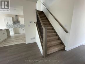 London South (South W) apartment for rent - A staircase in a home with a wooden floor and white walls.