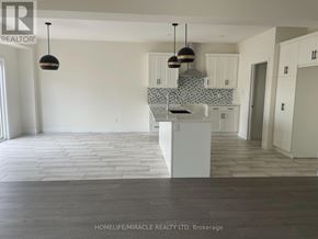 London South (South W) apartment for rent - A spacious kitchen with white cabinets and a tiled backsplash.