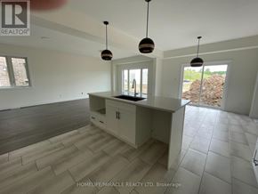 London South (South W) apartment for rent - A spacious kitchen with a large island and pendant lights.