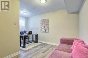 Toronto (Morningside) apartment for rent - A living room with a couch, chair, and a painting on the wall.