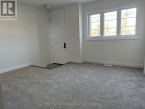 Markham (Angus Glen) townhouse for rent - A room with a carpeted floor, a door, and a window.