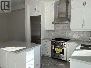 Markham (Angus Glen) townhouse for rent - A modern kitchen with white cabinets and a stainless steel oven.