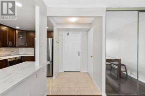 Mississauga (Fairview) condo for rent - A kitchen with white cabinets and a white countertop.