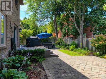 Oakville (Fd Ford) apartment for rent - A well-maintained garden with a brick pathway leading to a patio area.